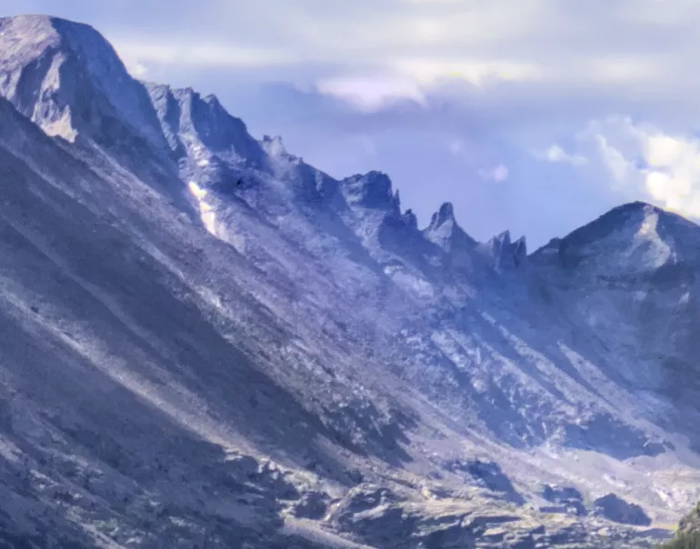 Mountain with lens flare corrected using different colors for the shadows and midtones