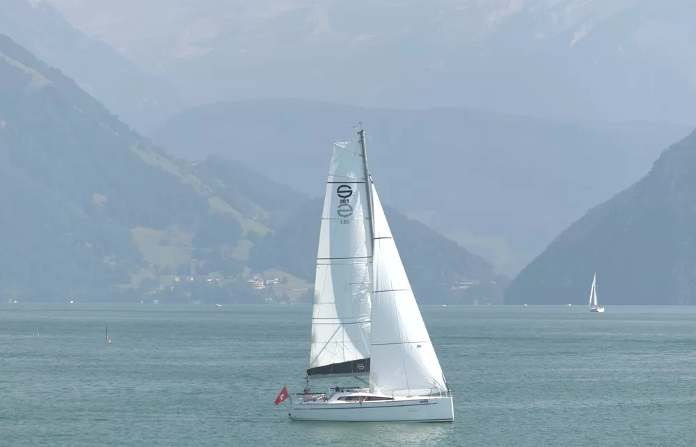 original telephoto shot of a boat on a large lake