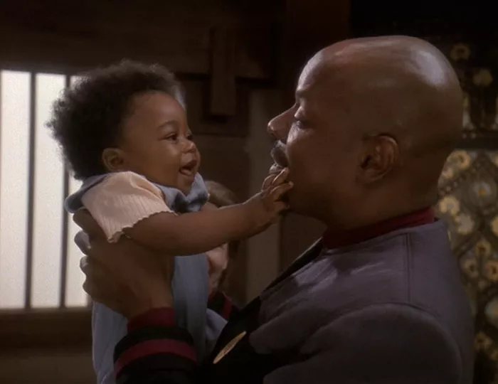 Sisko holds his young descendent