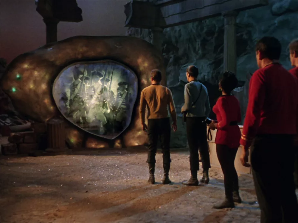 Captain Kirk both concerned for McCoy but also intrigued by The Guardian