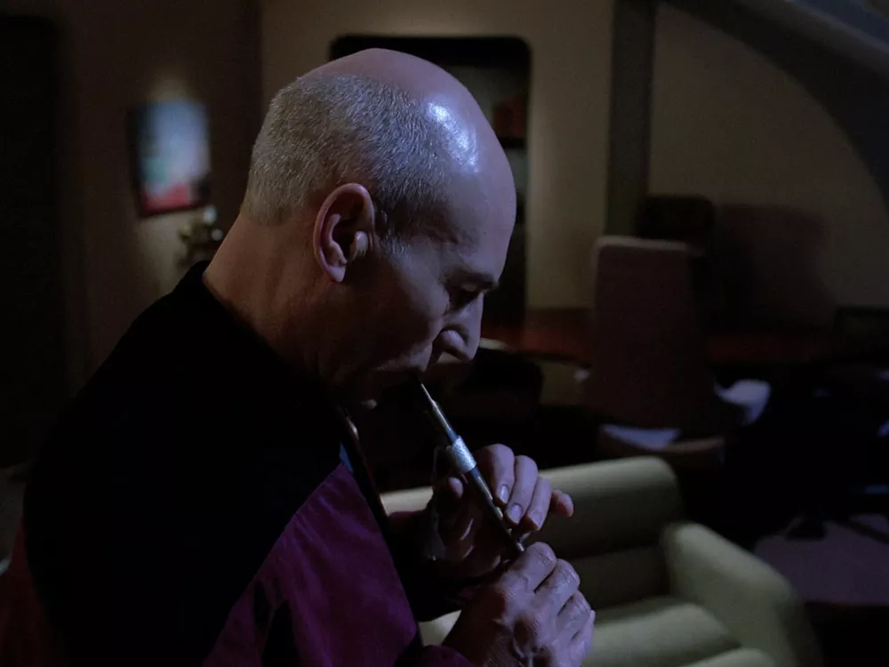 Picard plays his Ressikan flute alone in his quarters